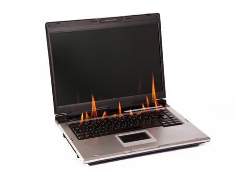 Laptop burning with fire on white background