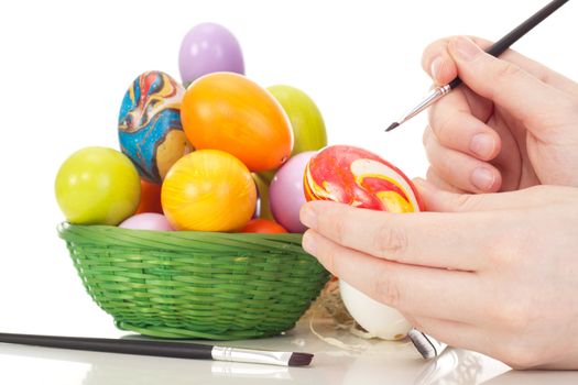 Person painting Easter eggs