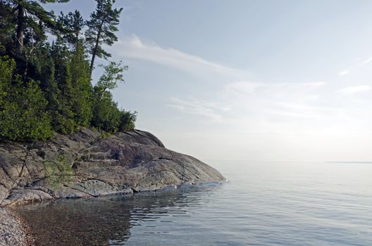 Rocky shore of Superior Lake at sunset