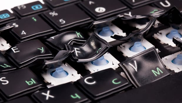 Black laptop keyboard with distorted keys on it