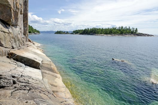 High cliff on the shore of Superior Lake