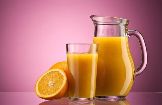 Orange juice over pink with ripe sliced orange