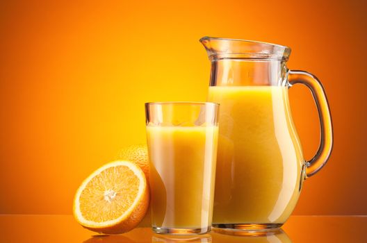 Orange juice over orange with ripe sliced orange