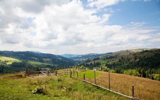 Fence in the meadow in Carpathian mountains
