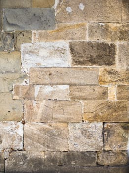 Close-up shot of a weathered brick wall.