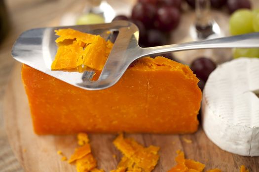 Orange Cheddar and feta cheese in a close-up image