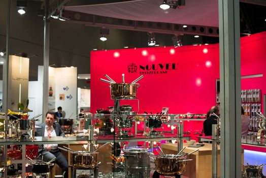 FRANKFURT, GERMANY – FEBRUARY 16, 2013: Booth of Swiss Company Nouvel on the Ambiente trade fair on February 16, 2013 in Frankfurt, Germany. Ambiente is the biggest exhibition for consumer goods worldwide. Nouvel is a Swiss company producing table cooking products, mainly the famous Swiss fondue sets.
