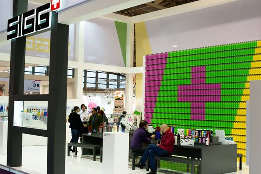 FRANKFURT, GERMANY – FEBRUARY 16, 2013: Booth of Swiss company SIGG on the Ambiente trade fair on February 16, 2013 in Frankfurt, Germany. Ambiente is the biggest exhibition for consumer goods worldwide. The Sigg company was founded over 100 years ago and specializes in reusable aluminium water bottles, over 90% of them being exported worldwide.