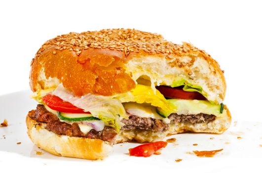 Big tasty bitten burger isolated on white
