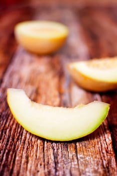 fresh organic melon slice over wooden boards