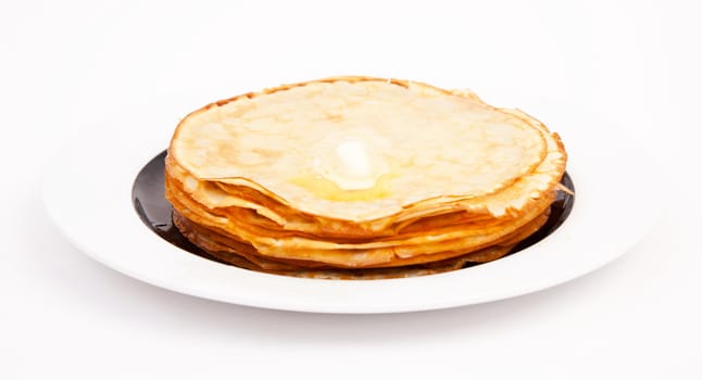 Crepe on white plate with butter