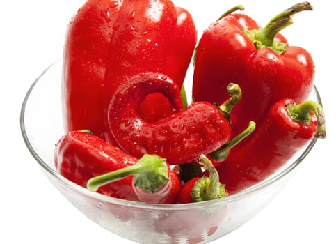Glass dish full of red and green pepper close view