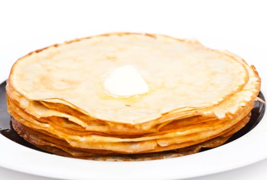 Crepe on white plate with butter