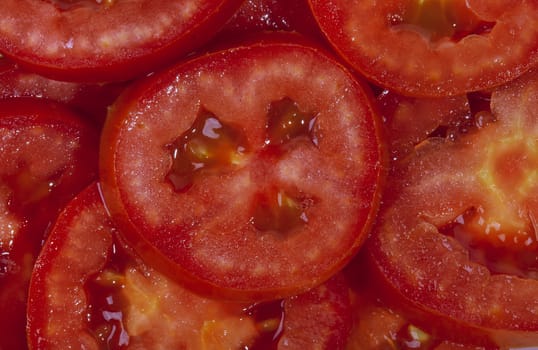Slices of red fresh tomatoes