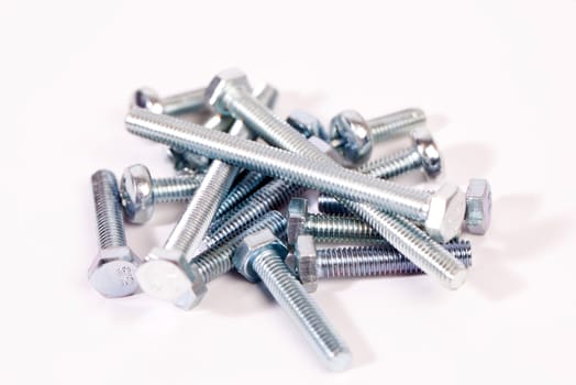 Metal bolts on white background