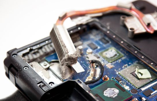 Laptop inside dirty cooling system full of dust