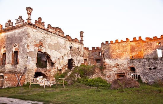 Medziboz castle ancient ruins during the sunset