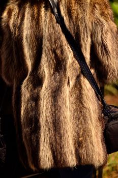 Brown and tan fur coat being worn