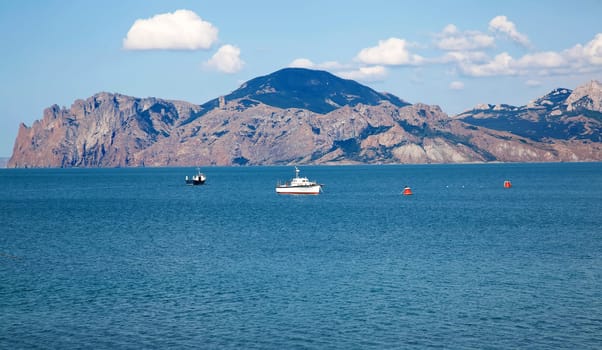 White boat in black sea in Crimea