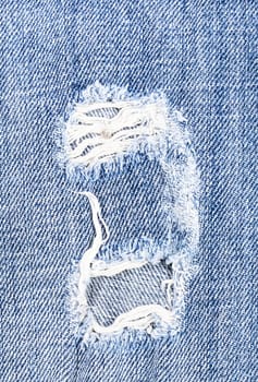 Beautiful hole in jeans textile