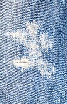 Hole on jeans denim fabric texture