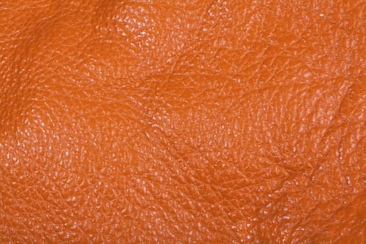 Orange leather texture background close view