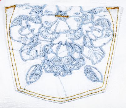 Pocket with embroidery on white jeans