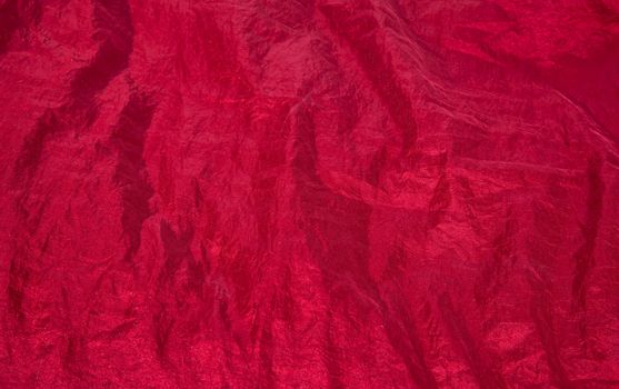 Shiny red fabric taffeta background pattern