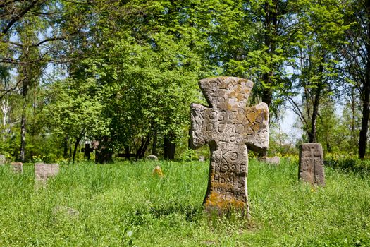 Ancient cross on the grass