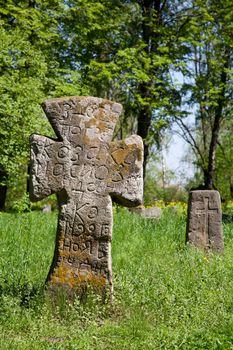 Cross on the prehistorical grave in forest