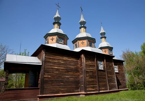Wooden church with three domes