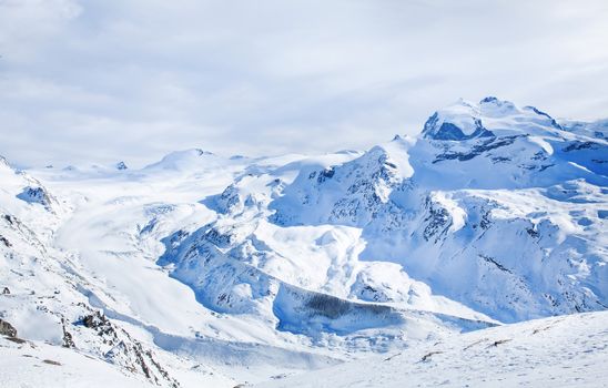 Winter blue and white landscape on Switzerland hills in February