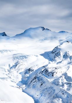 Winter snow hills landscape in light blue colors