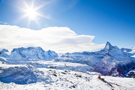 Winter swiss landscape on Switzerland hills with mountain Matterhorn