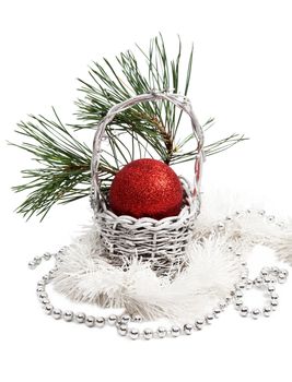 Christmas basket decoration with red ball on white background