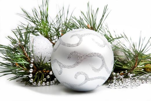 Christmas decorations with big silver ball and silver beads on white background