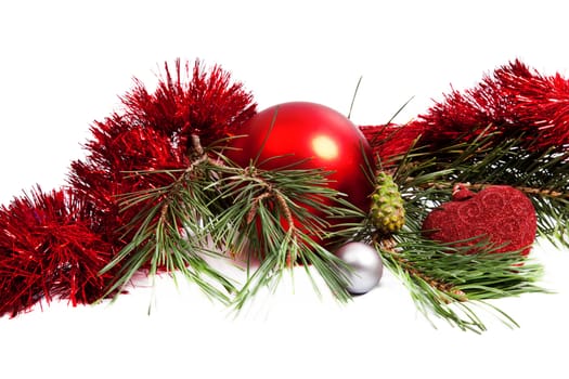 Christmas holiday composition with red ball and tinsel on white background