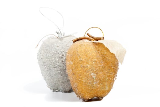 Golden and silver apples on white background