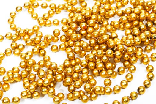 Golden beads new year decoration on white background