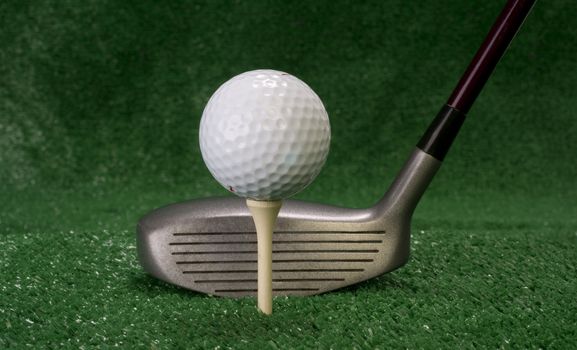 A golf club prepares to drive the ball