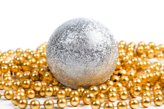 Silver ball with golden beads on white background