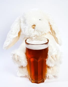 Toy rabbit with glass of beer