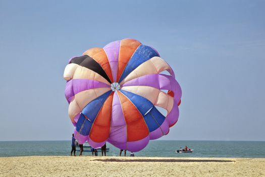 Horizontal seaside coastal ocean landscape, generic tropical of para gliders about to take flight over the ocean and beach area of Goa India