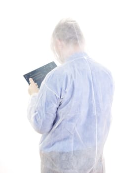 Man in disposable overall with mainboard