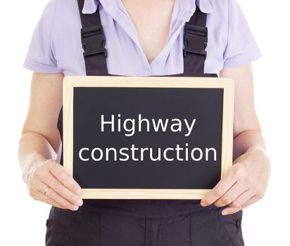Craftsperson with blackboard: highway construction