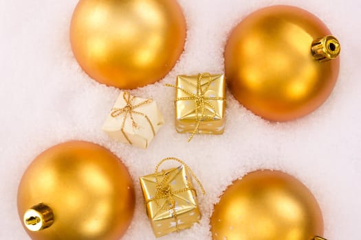 Christmas tree balls and gifts  in snow