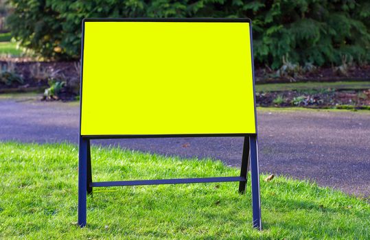 blank yellow low sign in the park