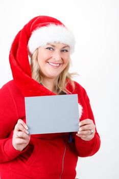 joyful pretty santa woman with empty sign on white background