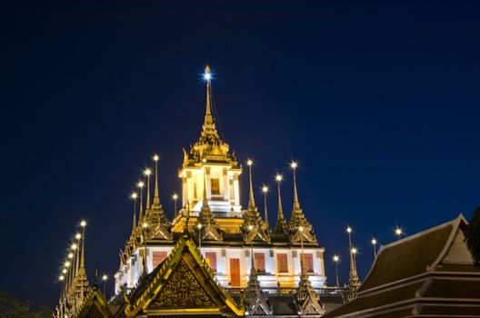 Twilight at Wat Ratchanatdaram Worawihan Temple, beautiful temple view to skyline in Bangkok, Thailand 