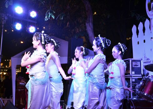 BANGKOK - DEC 16:Traditional Thai Dance at Phra Athit Walking Street, "Rattanakosin recall" festival on December 16, 2012 in Bangkok, Thailand. Its a tourist attraction primarily for night life and entertainment 